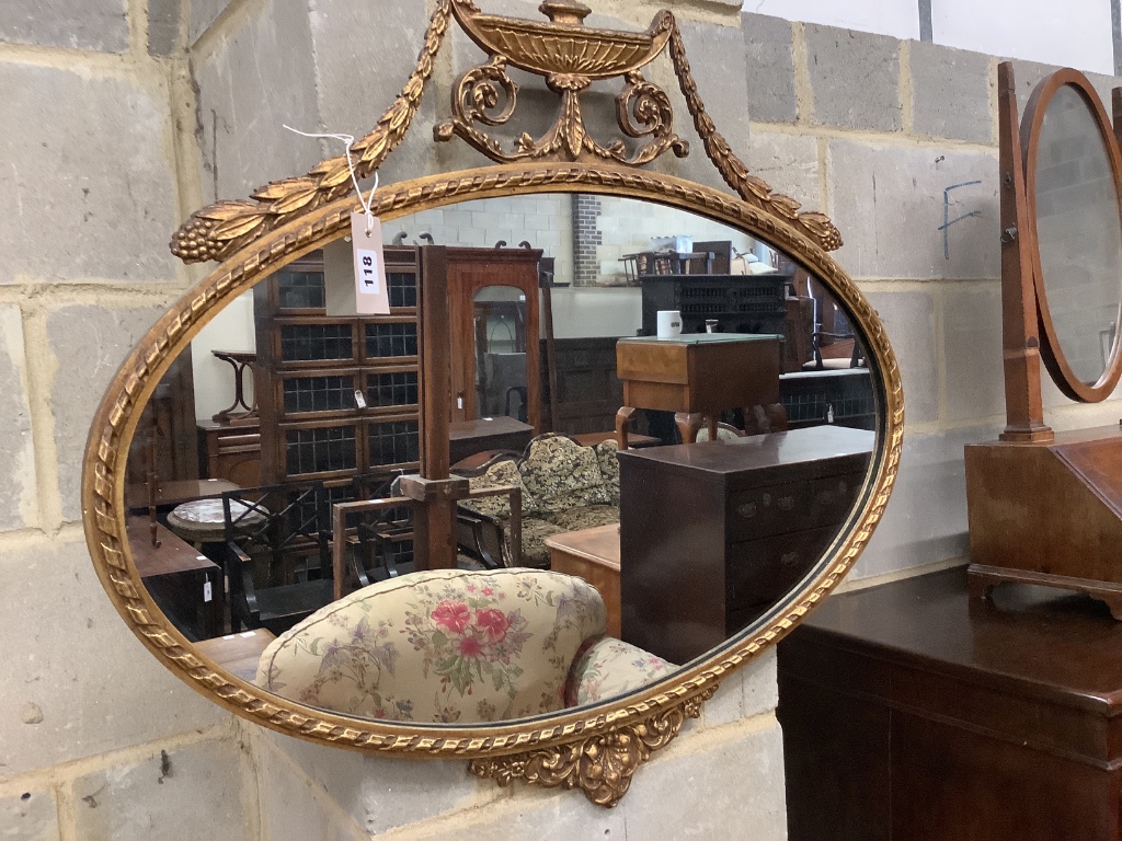 An oval gilt framed Adam design wall mirror, width 80cm height 70cm